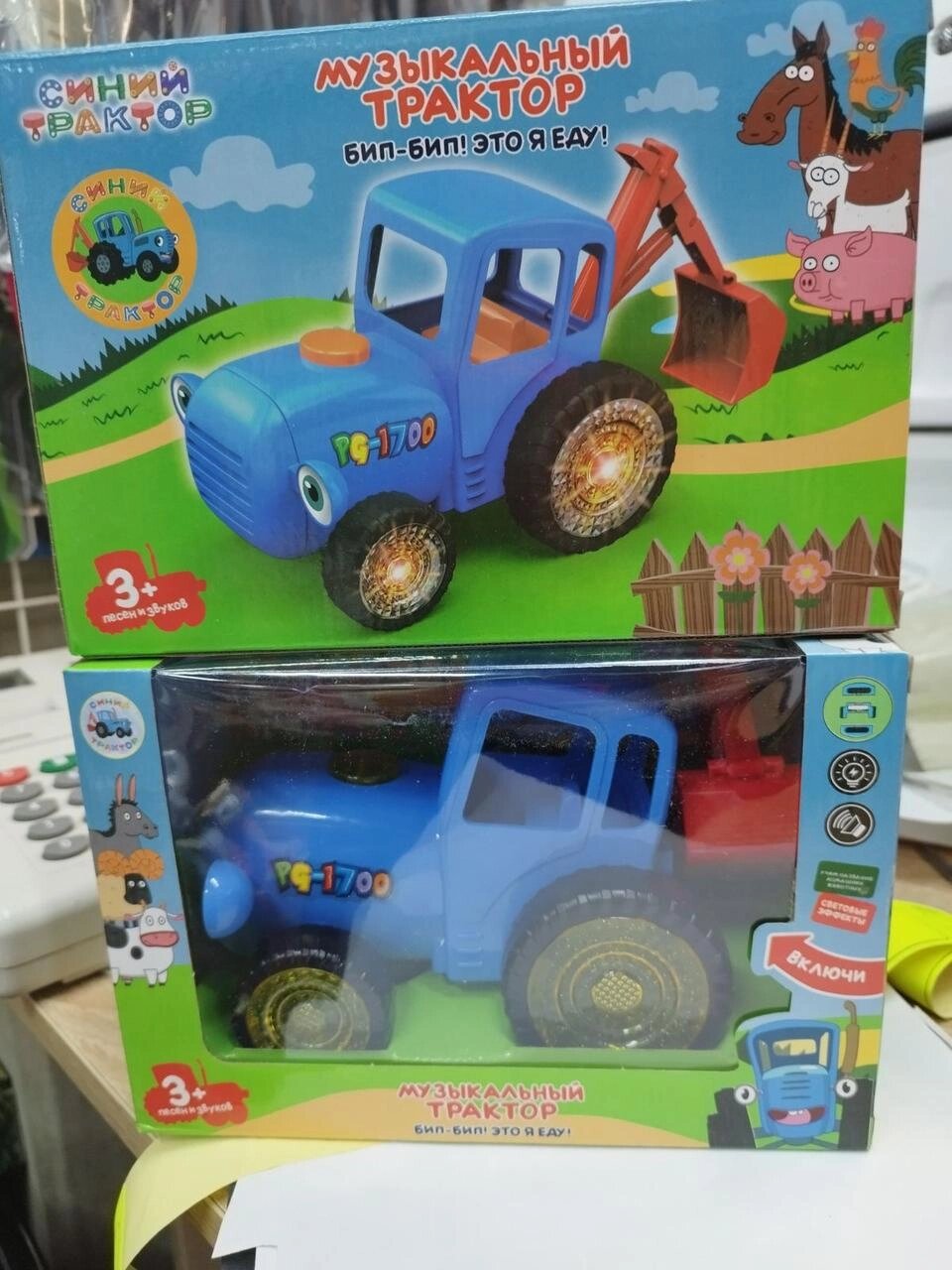 Игрушка каталка трактор "синий трактор" с ковшом ездит светится от батареек от компании Интернет магазин детских игрушек Ny-pogodi. by - фото 1