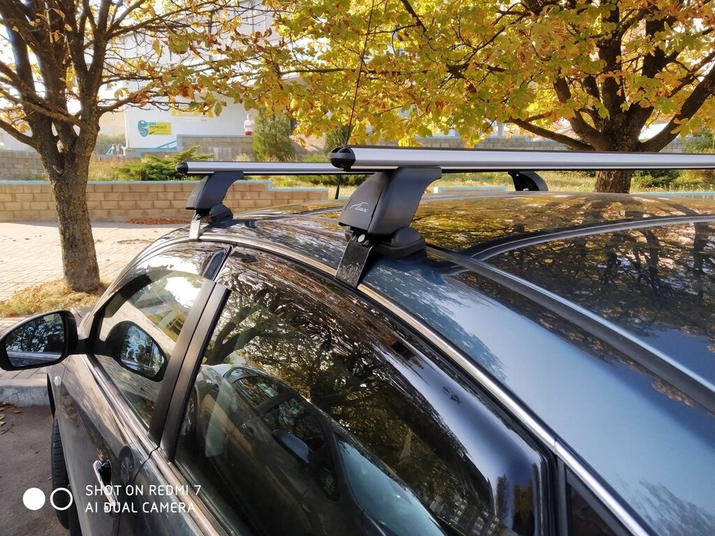 Багажник LUX для Nissan Almera III, 2012-...  (аэродинамическая дуга) от компании ООО «ПЛАРК ТРЭЙД» - фото 1