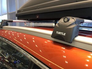 Багажник Turtle Air 2 серебристые для Opel Astra универсал с интегрированными рейлингами