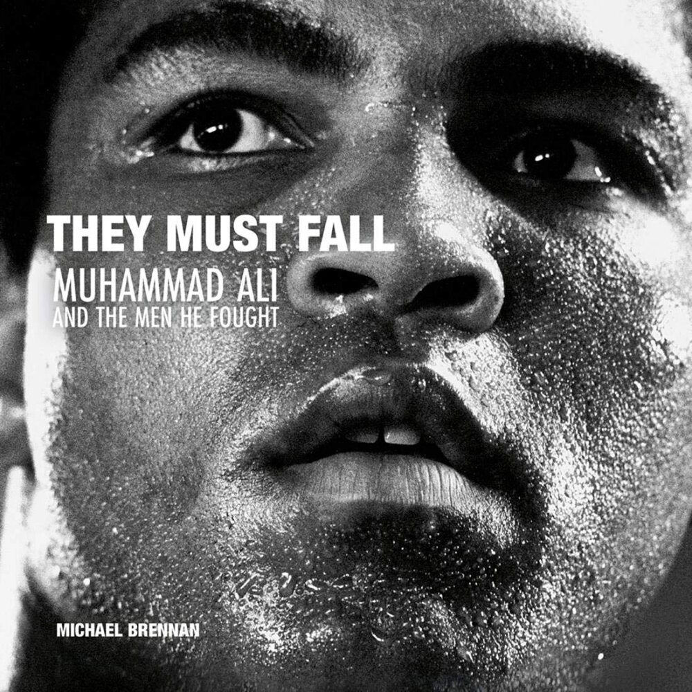 Книга на английском языке "They Must Fall. Muhammad Ali and the Men He Fought", Michael Brennan от компании «Офистон маркет» - фото 1